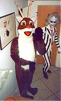 RUDOLPH alone (RICK) w/ 
BEETLEJUICE behind and a beautiful painting by Alex's Mother adorns 
the wall.