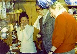 Arthur Rankin, Jr. and Danny Kaye admire the artistic talents of Kyoko Kito.
